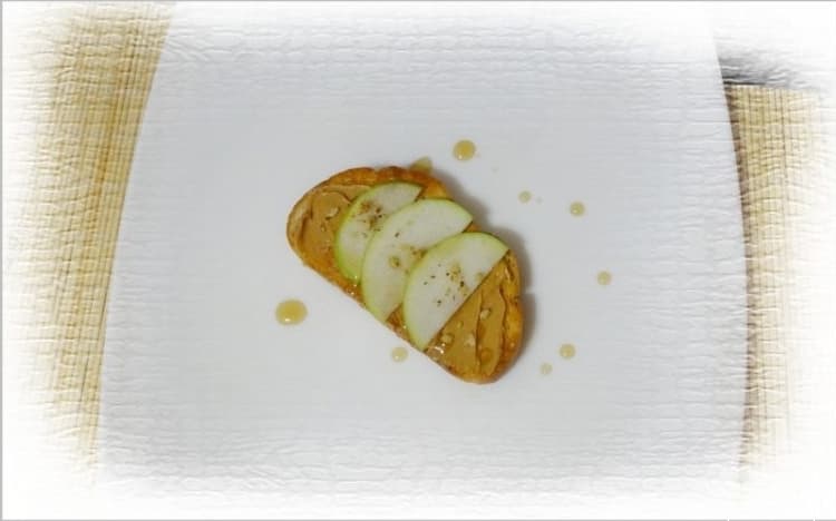 Sandwich with peanut butter and apple