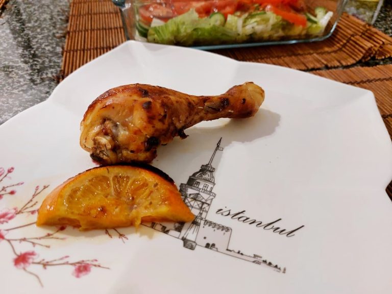 Chicken legs baked with oranges