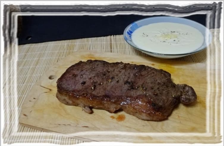 Ribeye steak with cheese sauce